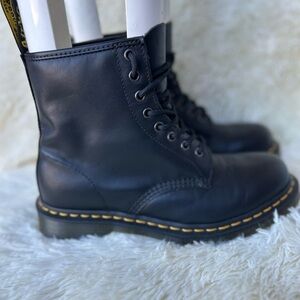 Dr. Martens 1460 Black Smooth boots, which are iconic 8-eye lace-up combat boots